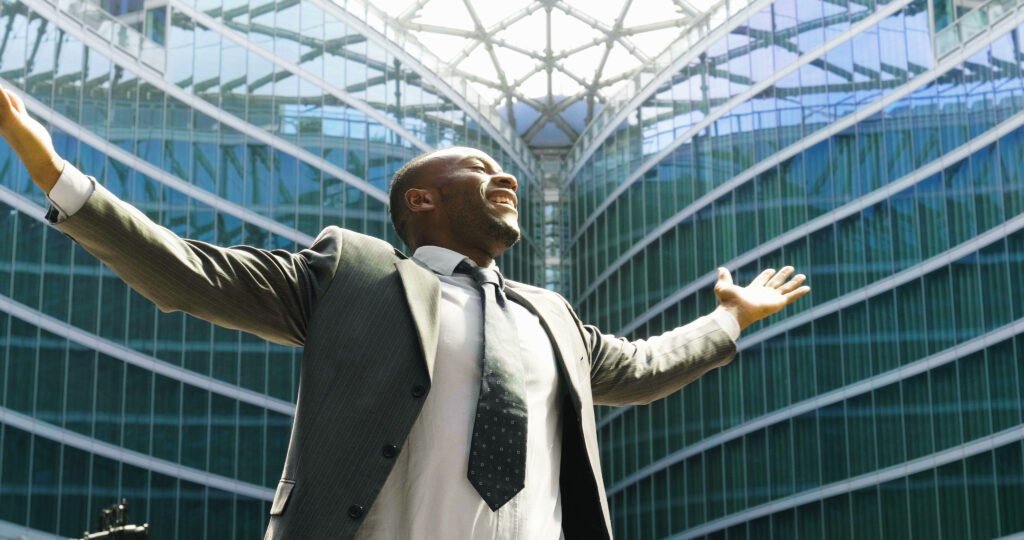 a-businessman-laughed-with-open-arms-and-smiling-for-her-success-in-working
