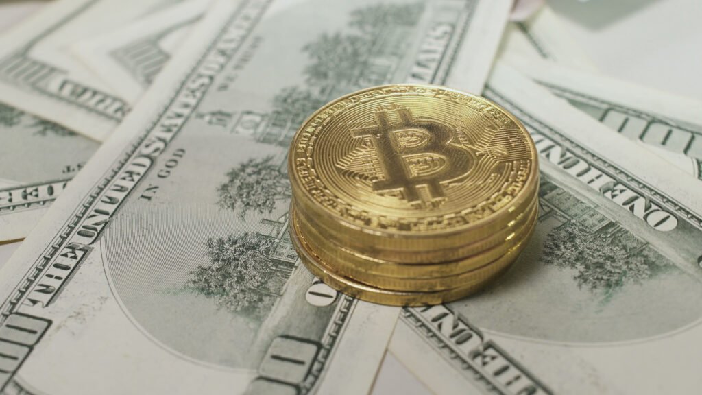 dollars-move-under-stack-of-bitcoins